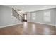 Inviting living space with hardwood floors, staircase, and natural light at 1592 Farmington Hills Dr, Conover, NC 28613