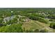 An aerial view showcasing the golf course and community amenities amid lush greenery and fairways at 16070 Palawan Ct, Tega Cay, SC 29708