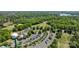 Overhead shot showcases manicured greens, a golf course, and clubhouse nestled amid vibrant greenery at 16070 Palawan Ct, Tega Cay, SC 29708