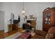 Bright home office space with wood floors, generous shelving, and a view to another room at 16070 Palawan Ct, Tega Cay, SC 29708