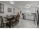 Bright kitchen with white cabinets, stainless steel appliances, and a dining table set at 16070 Palawan Ct, Tega Cay, SC 29708