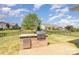 Outdoor kitchen with a built-in grill and counter space, perfect for entertaining in the backyard at 1670 Tranquility Blvd, Lancaster, SC 29720