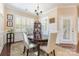 Inviting dining room with hardwood floors, wainscoting, white shuttered windows and stylish decor at 1670 Tranquility Blvd, Lancaster, SC 29720
