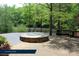 Gather around a beautiful outdoor community firepit, perfect for cool evenings and conversation at 1670 Tranquility Blvd, Lancaster, SC 29720