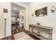 Inviting foyer with hardwood floors, console table, and a view into the living room at 1670 Tranquility Blvd, Lancaster, SC 29720