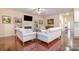 Inviting living room with a fireplace, built-in bookshelves, and hardwood floors at 1670 Tranquility Blvd, Lancaster, SC 29720