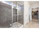 Modern bathroom with tiled glass shower, window and a walk-in closet at 1670 Tranquility Blvd, Lancaster, SC 29720