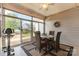 Cozy sunroom with a ceiling fan, string lights, and sliding glass doors leading to the backyard at 1670 Tranquility Blvd, Lancaster, SC 29720