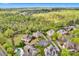 Stunning aerial view of a neighborhood surrounded by lush forests and well-manicured lawns at 17909 Golden Meadow Ct, Davidson, NC 28036