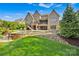 Expansive backyard with a pool, waterfall feature, and manicured lawn at 17909 Golden Meadow Ct, Davidson, NC 28036