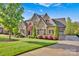 Stunning home with a three-car garage, extensive driveway, and manicured front yard at 17909 Golden Meadow Ct, Davidson, NC 28036