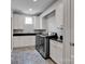 Well-equipped laundry room features modern washer, dryer, and lots of bright white cabinets at 17909 Golden Meadow Ct, Davidson, NC 28036
