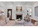 Elegant living room with marble fireplace, coffered ceiling, and natural light at 17909 Golden Meadow Ct, Davidson, NC 28036