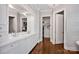 Luxurious main bathroom with double vanity, walk-in closet, and elegant finishes at 17909 Golden Meadow Ct, Davidson, NC 28036