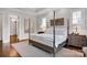 Serene main bedroom featuring hardwood floors, soft lighting, and elegant decor at 17909 Golden Meadow Ct, Davidson, NC 28036