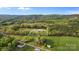 Lush aerial view showing expansive lot, mature trees, and quiet country setting at 1821 Hopewell Church Rd, Hiddenite, NC 28636