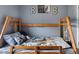 Close-up of a wooden bunk bed with decor and bedding at 1821 Hopewell Church Rd, Hiddenite, NC 28636