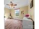 Bright bedroom with a window, hardwood floors, and a white dresser at 1821 Hopewell Church Rd, Hiddenite, NC 28636