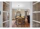 Inviting dining room featuring hardwood floors, neutral paint, and charming decor at 1821 Hopewell Church Rd, Hiddenite, NC 28636