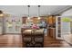 The kitchen features wood cabinets, stainless steel appliances, and center island seating at 1821 Hopewell Church Rd, Hiddenite, NC 28636