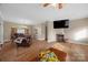 Spacious living room with hardwood floors and cozy furnishings at 1821 Hopewell Church Rd, Hiddenite, NC 28636