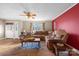 Comfortable living room with a large sectional sofa, hardwood floors, and ample sunlight at 1821 Hopewell Church Rd, Hiddenite, NC 28636