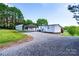 Exterior of home featuring a gravel driveway and a covered parking area at 186 Ellendale Ln, Taylorsville, NC 28681
