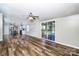 Open floor plan featuring durable flooring and sliding glass doors to an outdoor space at 186 Ellendale Ln, Taylorsville, NC 28681