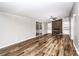 Cozy living room with a stone fireplace, built-in shelving, sliding glass doors and laminate flooring at 186 Ellendale Ln, Taylorsville, NC 28681