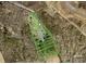 Aerial view of a lot with outlined property lines and tree coverage in a neighborhood setting at 1869 Wooten St, Catawba, NC 28673