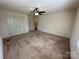 Bedroom featuring plush carpet, a ceiling fan, and two closets for plenty of storage at 1869 Wooten St, Catawba, NC 28673