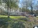 Exterior view of a single-wide home with a small ramp leading up to the front porch at 1869 Wooten St, Catawba, NC 28673