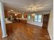 Open kitchen with hardwood floors, stainless steel appliances, and wooden cabinets at 1869 Wooten St, Catawba, NC 28673