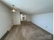 Living room with plush carpet and bright white walls at 1869 Wooten St, Catawba, NC 28673