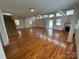 Open-concept living room featuring hardwood floors, a fireplace, and an abundance of natural light at 1869 Wooten St, Catawba, NC 28673