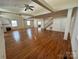 Spacious living room boasting hardwood floors, a fireplace, and a staircase leading to the upper level at 1869 Wooten St, Catawba, NC 28673