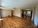 Living room with hardwood floors, and yellow walls and decorative columns at 1869 Wooten St, Catawba, NC 28673