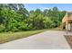 Large, paved backyard with lush greenery and bamboo, offering a serene and private outdoor space at 1904 27Th Avenue Ne Dr, Hickory, NC 28601