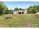 Spacious backyard with mature trees, a wooden deck, and two-car garage at 1904 27Th Avenue Ne Dr, Hickory, NC 28601