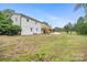 Large backyard with a wooden deck, stairs, and a grassy area at 1904 27Th Avenue Ne Dr, Hickory, NC 28601
