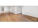 Large finished basement with wood-look floors and white painted walls at 1904 27Th Avenue Ne Dr, Hickory, NC 28601