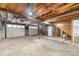 Unfinished basement with exposed wood ceiling and concrete floors at 1904 27Th Avenue Ne Dr, Hickory, NC 28601
