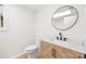 Bathroom with a modern vanity, mirror, and toilet at 1904 27Th Avenue Ne Dr, Hickory, NC 28601
