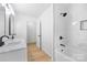 Stylish bathroom with double vanity, marble countertop, and tiled shower-tub combination at 1904 27Th Avenue Ne Dr, Hickory, NC 28601