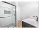 Modern bathroom with a glass-enclosed shower, white marble tiles, and a sleek vanity at 1904 27Th Avenue Ne Dr, Hickory, NC 28601