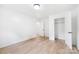 Bedroom with white walls, wood floors, and an open closet, offering a minimalist design at 1904 27Th Avenue Ne Dr, Hickory, NC 28601