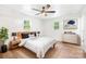 Bright bedroom features new ceiling fan, modern decor, and natural light from windows at 1904 27Th Avenue Ne Dr, Hickory, NC 28601