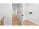 Hallway with access to the unfinished area and hookups for a washer and dryer at 1904 27Th Avenue Ne Dr, Hickory, NC 28601