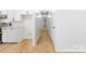 Bright hallway with light wood floors and white walls, leading to other rooms at 1904 27Th Avenue Ne Dr, Hickory, NC 28601