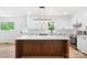 Bright kitchen featuring a large island with quartz countertops and modern appliances at 1904 27Th Avenue Ne Dr, Hickory, NC 28601
